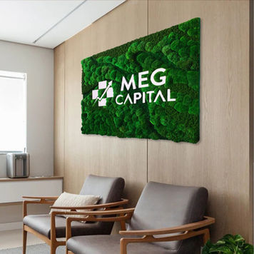 Moss Forest Style mixed moss wall with custom 3D logo at MEG Capital office, natural textured biophilic feature wall installation.