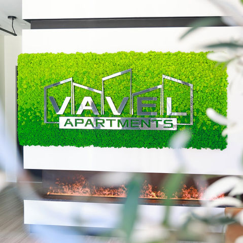 Gradient Reindeer Moss Logo with stainless steel on apartment wall, seamlessly enhancing both front and side views.