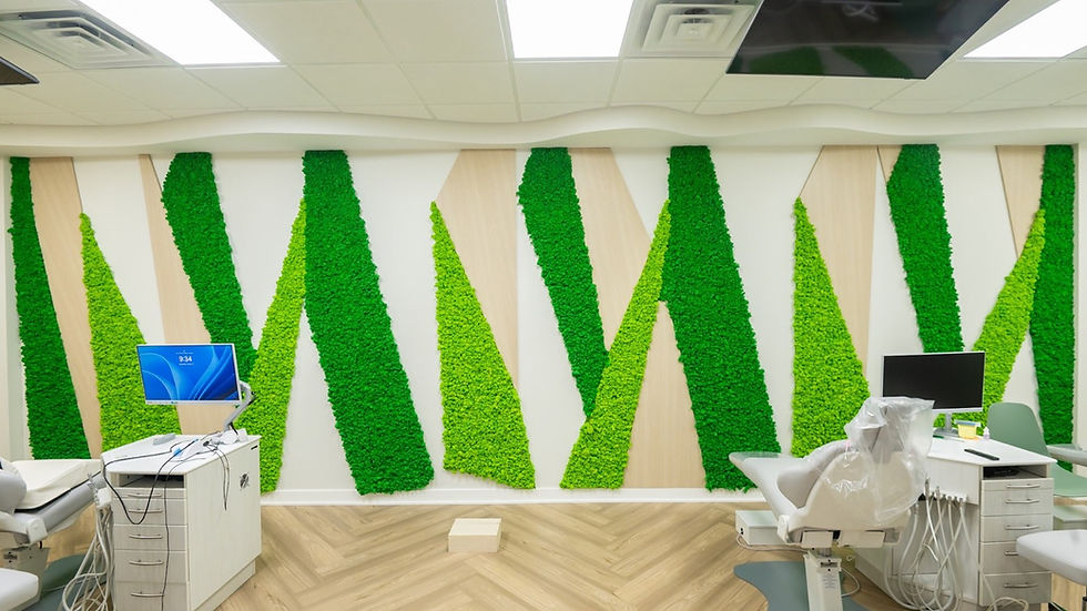 Dental treatment room featuring geometric reindeer moss panels design with alternating light and dark green stripes