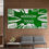 Thumbnail: Green reindeer moss wall with white PVC carved cityscape and Addison Texas logo installed in modern commercial lobby.