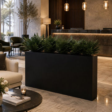 Modern black planter with lush greenery in a luxury hotel lobby lounge