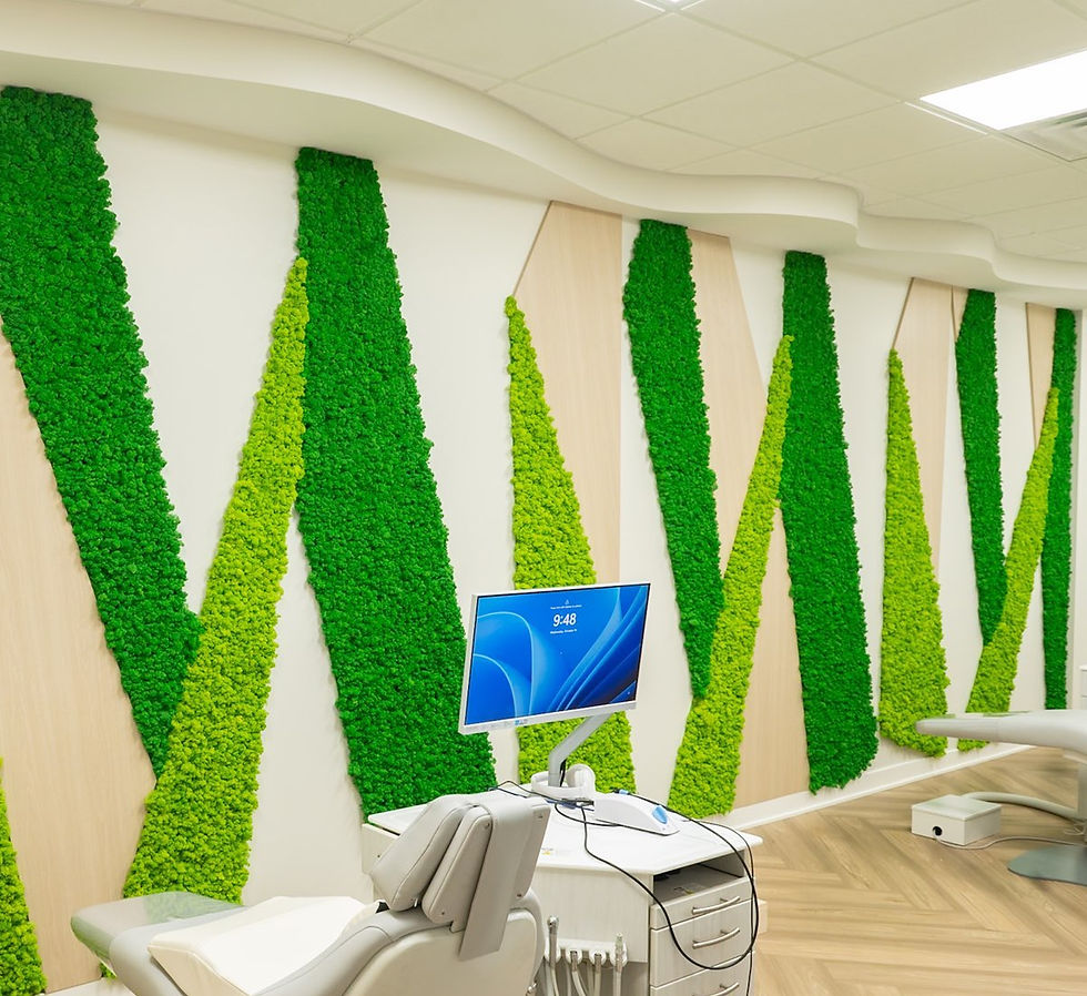 Geometric reindeer moss wall with green panels, adding texture and biophilic design to the interior.