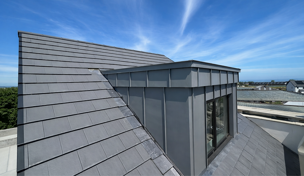 Bespoke zinc box dormer in Rush clad in VM Zinc Quartz,