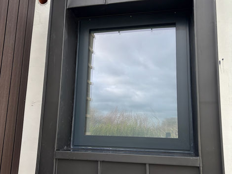 Feature window surround clad in VM Zinc Anthra standing seam zinc on a residential property in Drumcondra, Dublin.