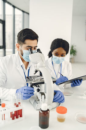 new-test-concentrated-skilled-researchers-wearing-uniform-doing-test-creating-vaccine.jpg