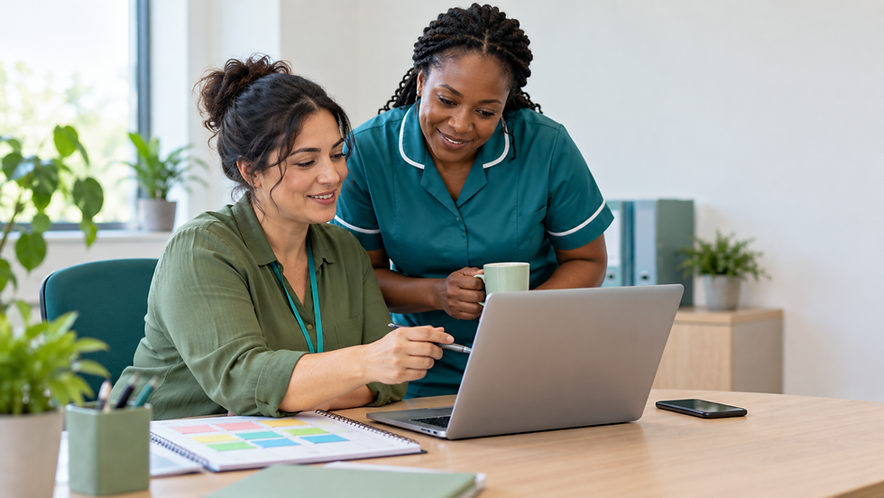 A care coordinator and colleague reviewing a laptop and shift planner