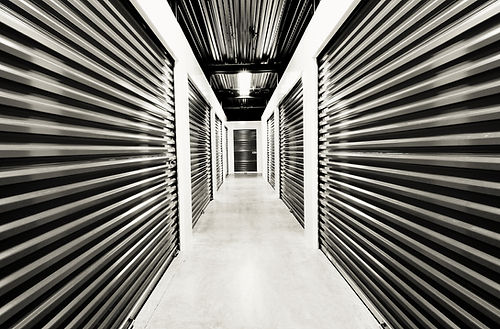 Self storage doors. Life style, storage, moving, storing, organizing concept. Grungy backg