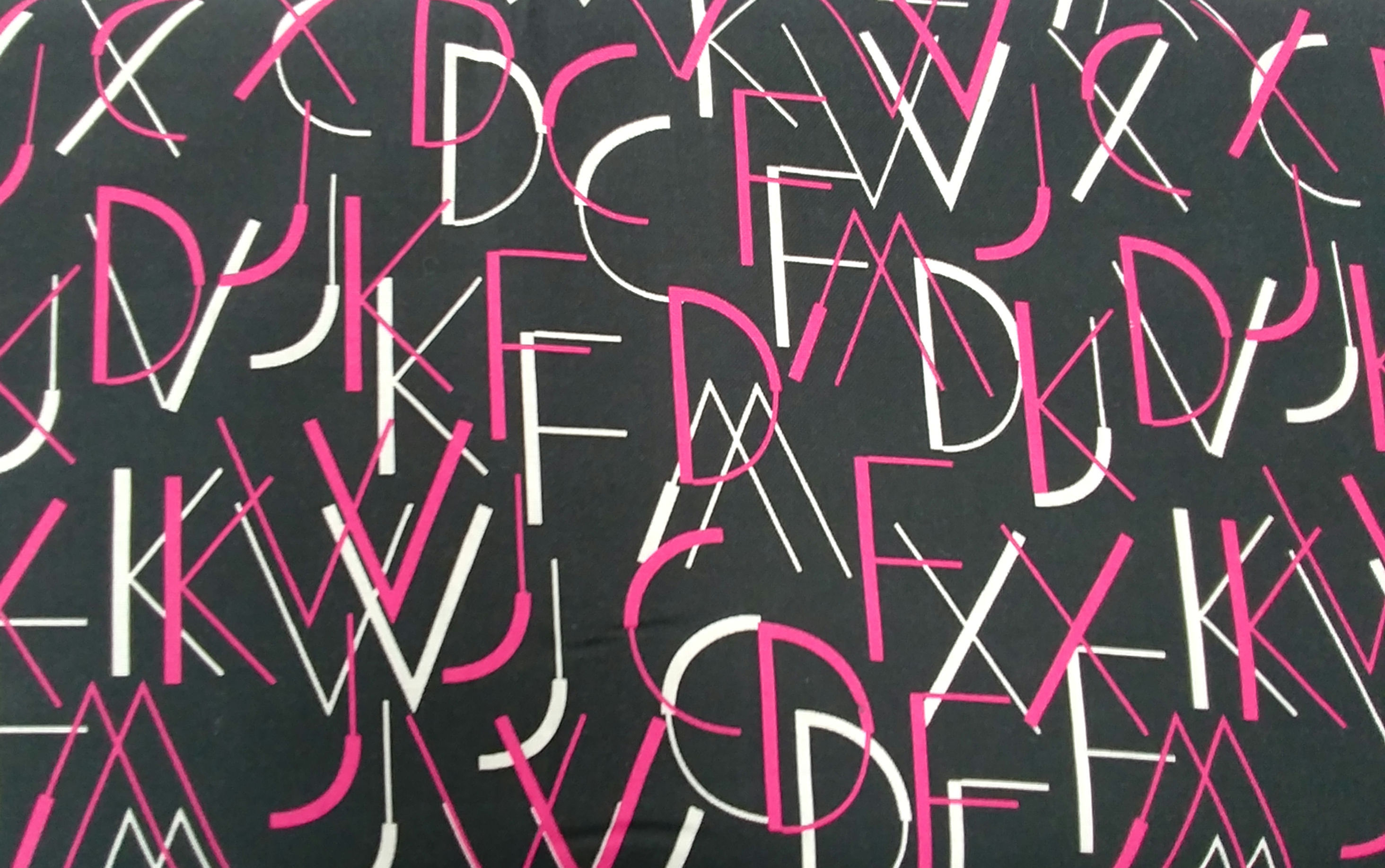 Wild Text black/fuschia fabric by the yard