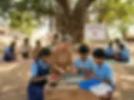Outdoor photograph of a woman teaching children electronics repair. A humanitarian community project fosters hands-on learning under a large tree.