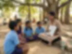Outdoor photography of a woman teaching a group of children about plants using a tablet under a large tree. The scene conveys an engaging and natural learning environment.