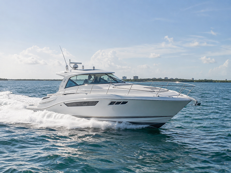 White motor yacht cruising through blue water with wake