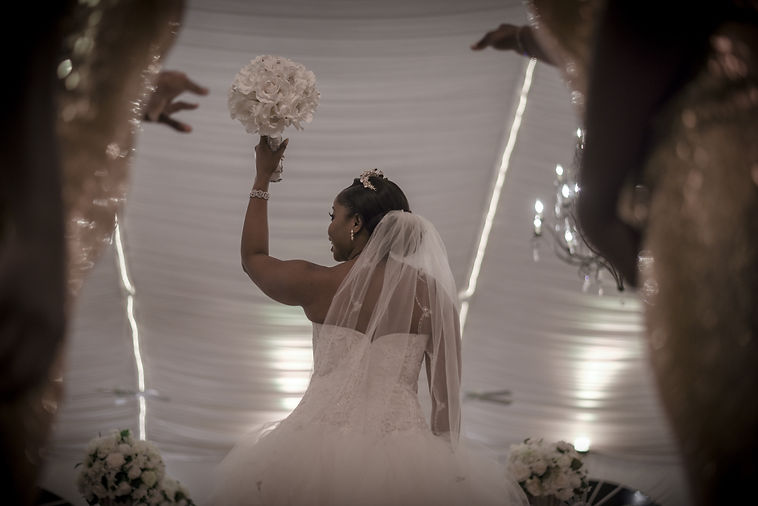 woman-in-white-floral-wedding-dress-holding-bouquet-of-white-3975613.jpg