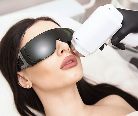 A woman undergoing a Intense pulsed light (IPL) treatment wearing protective glasses.