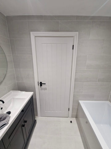 White 'Cottage' style doors with matt black handles in Royton