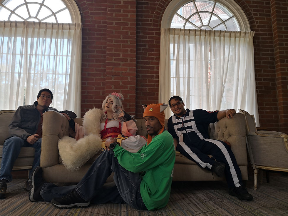 Four friends posing at Anime USA