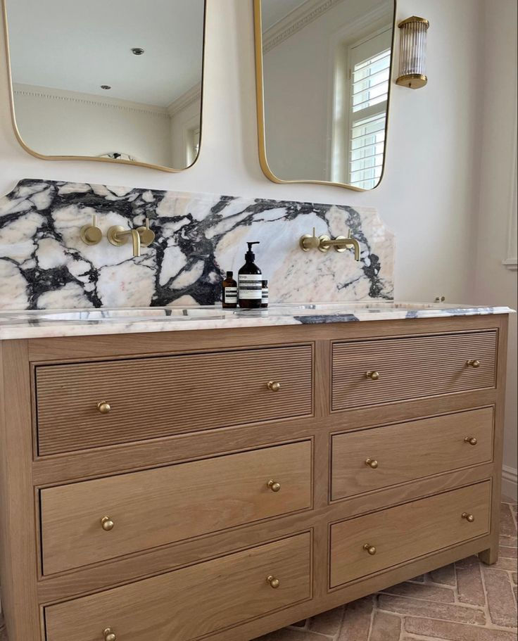 Clean, moisture-proof, and seal service for guest bathroom vanity in Arabescato Venato white marble with bordered backsplash - Renovation - New Orleans, LA