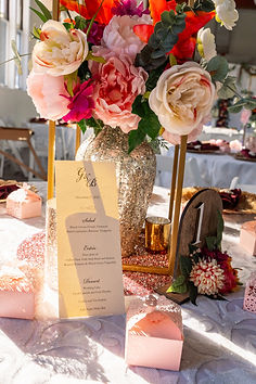 A pastel pink and gold themed table centerpiece