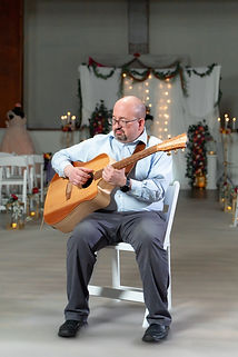 An event musician playing the guitar