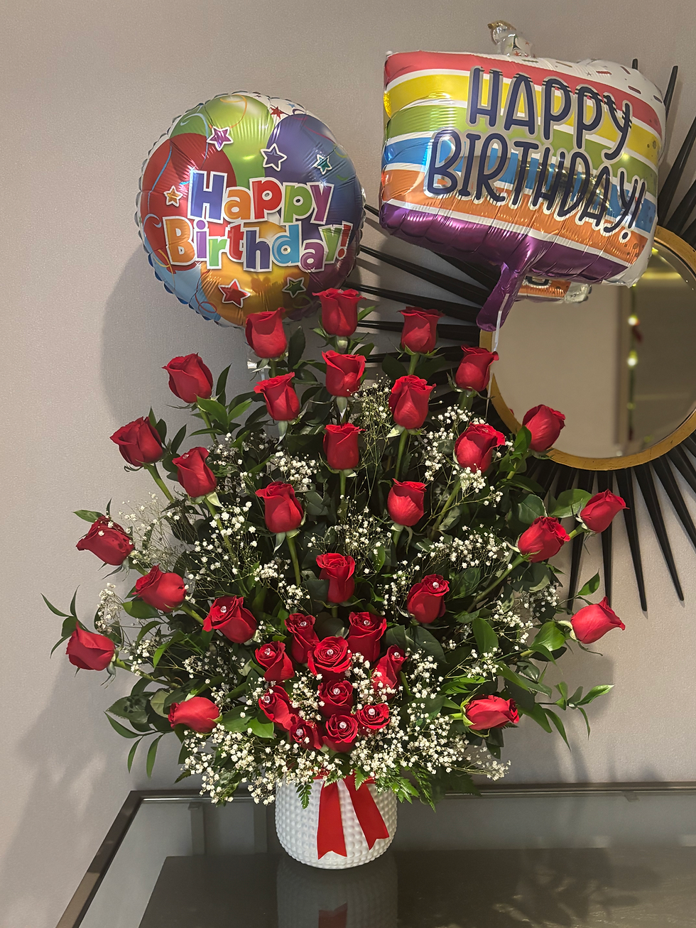 Happy Birthday balloons with a bouquet of 100 red roses and vase display.