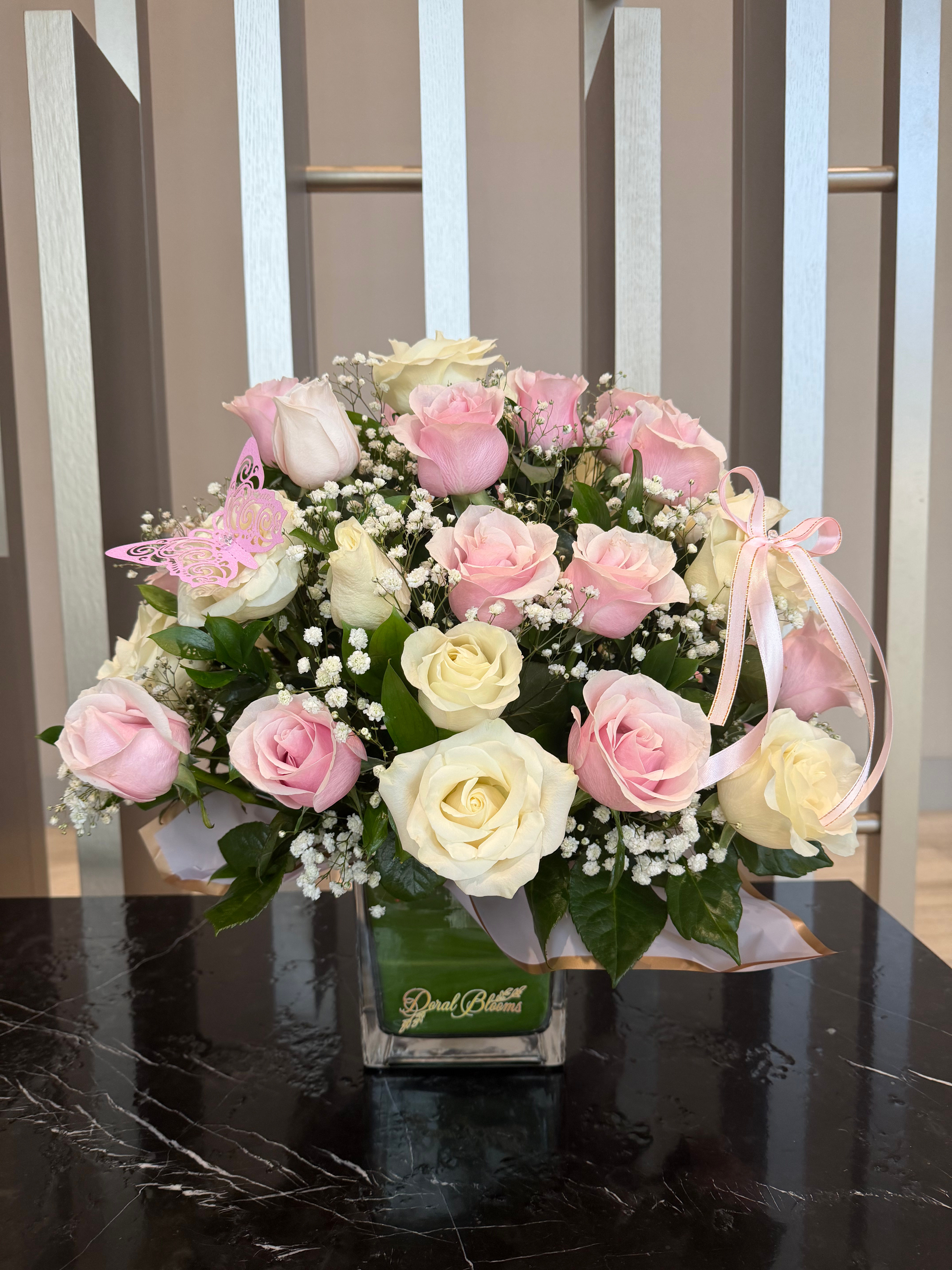 Elegant Round Arrangement in Pastel Colors with 50 Roses