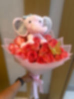 Pink Elephant toy on a bouquet of roses with a butterfly, Doral Blooms