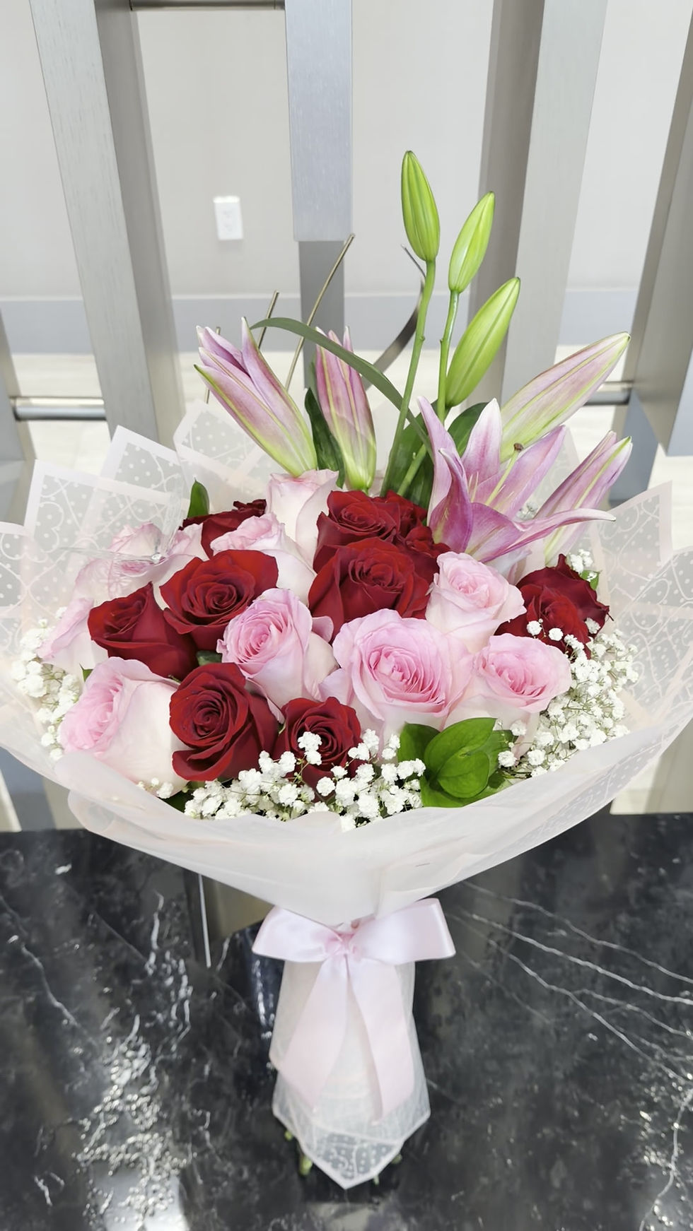 Thumbnail: Red and Pink Rose Bouquet with Lilies and Foliage