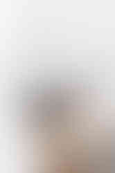 a bottle of rise + shine sits on a wooden table