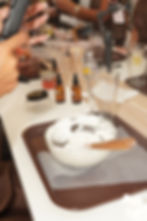 Hands mixing ingredients in a bowl, a fun thing to do in Houston