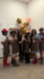 Fun activity in Houston with women in cowboy hats.
