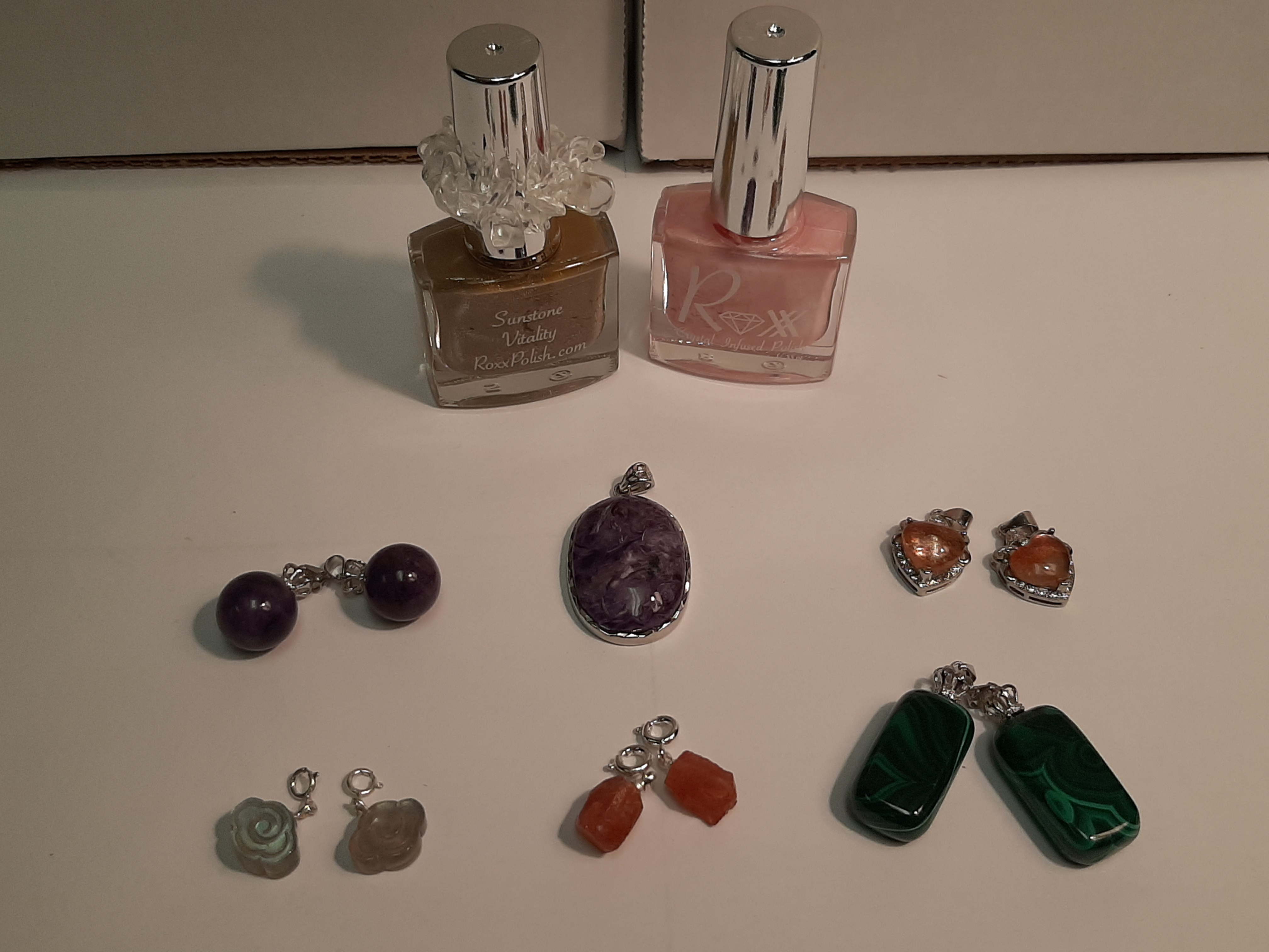Earrings, pendants and nail polish