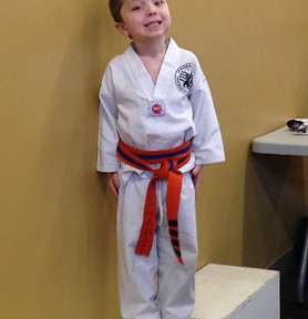 Shane Rasche pic website as orange belt.jpeg