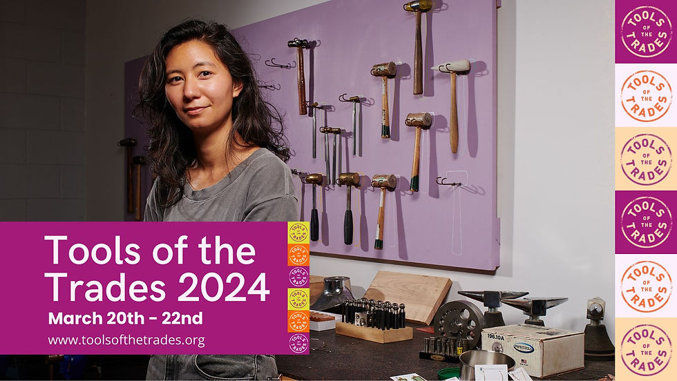 Tools of the trade ad girl in front of wall of hammers