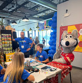 KC Wolf sitting at the table with Architecting the Mastery
