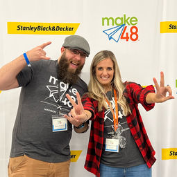 tool tech and make48 courtney making silly faces in front of the stanley black and decker step and repeat banner