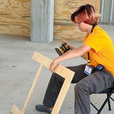 Smarts and Sparks Lux sanding their prototype