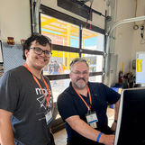 Tool Tech Stan and his son Phillip working at a computer