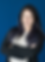 A headshhot of tori hasson smiling with blue background