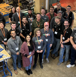 tool tech group photo in the wood shop
