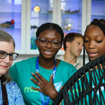 Two Southern Heat students talking to a VIP guest