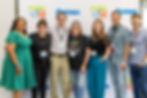 7 men and women posing in front of Make48 Fastenal banner