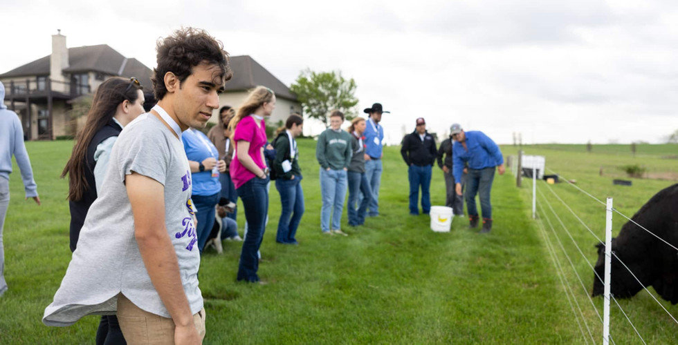 Students on farm with cows