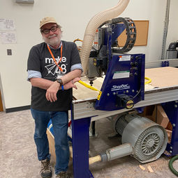 tool tech chris standing next to the shopbot
