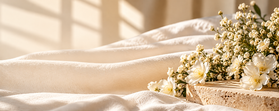 Small white flowers on draped fabric for Maison Amaré