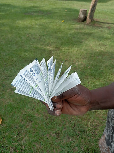 Farmer holding 12 sachets.jpg
