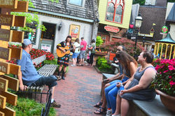 Singing at the center fountain in The Village