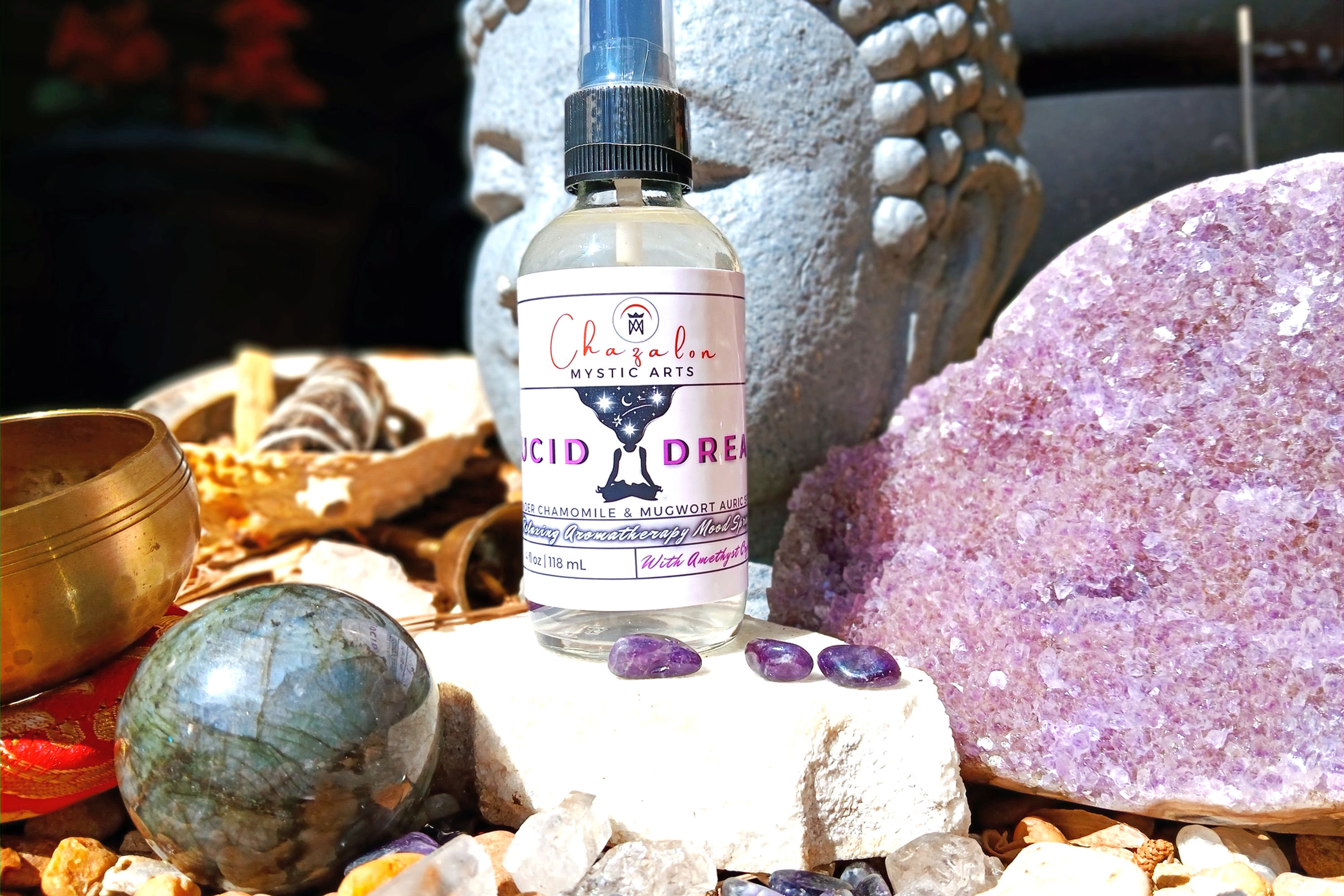 Image of Lucid Dream spray surrounded by amethyst crystals and buddah statue