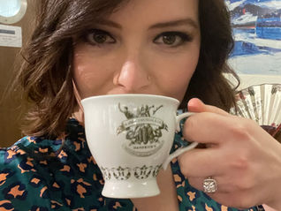 Woman sipping tea from a teacup