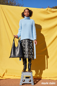 Editorial fashion model in a Jason Wu sweater, and Baum und Pferdgarten skirt photographed in Malibu.