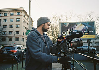 man filming a scene