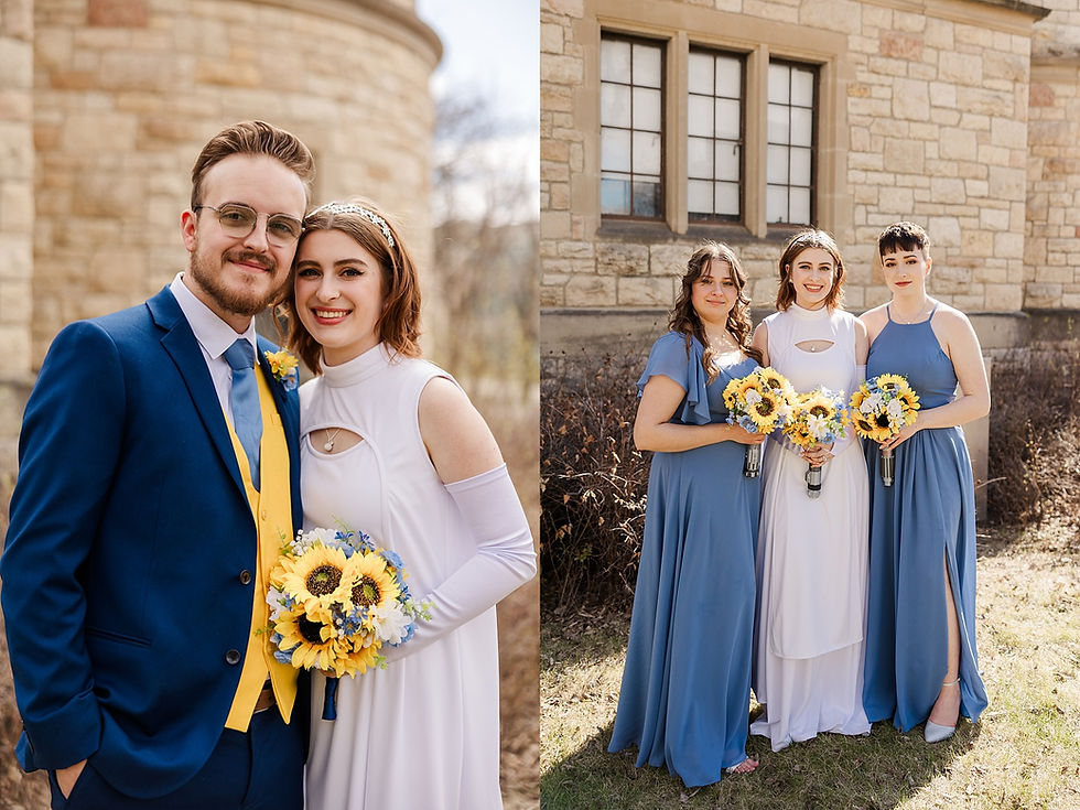 Bride in white with groom in blue suit, smiling beside a stone building. Bride and two bridesmaids hold sunflower bouquets. Sunny day.